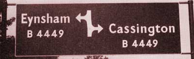 Oxfordshire-style sign for a staggered junction on the A40 west of Oxford. Click to enlarge