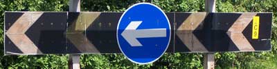 Turn left! It's how all roundabouts work.