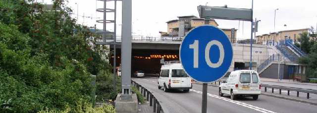 A rare example of a blue speed limit sign, indicating the Blackwall Tunnel's 10mph minimum limit. Click to enlarge