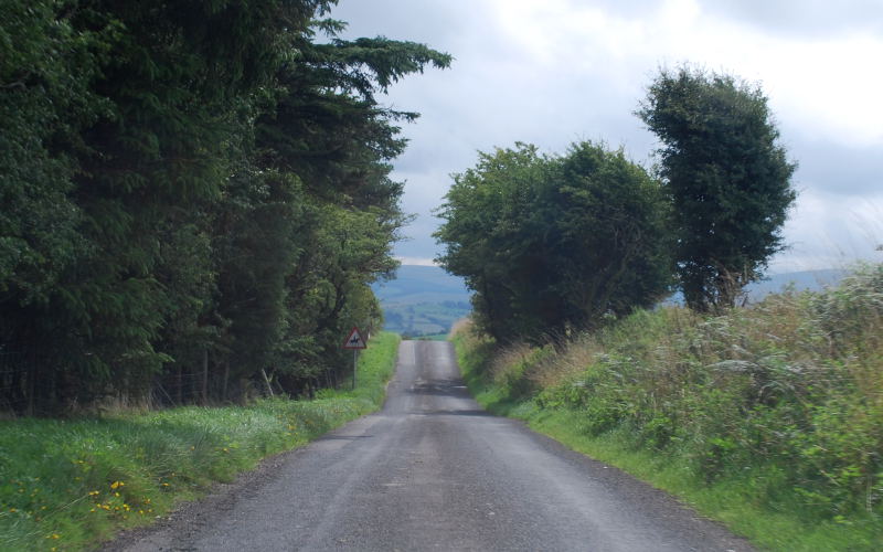 The alignment of the road is basically that of a rural farm track, because that's what it is, complete with blind crests.