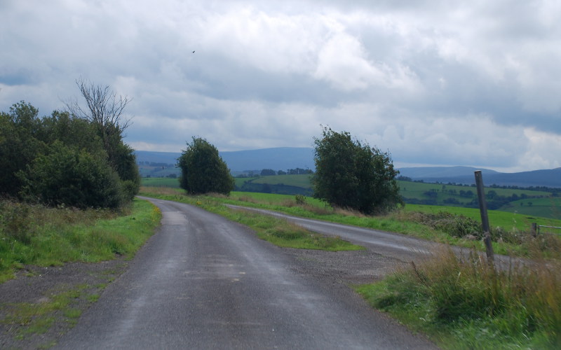 Field accesses and the occasional driveway are served by crossovers through the central reservation.