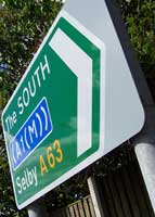 A green direction sign