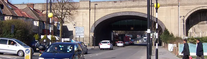The arched Central Line viaduct, with extra-wide span to cross Greenford Road. Click to enlarge