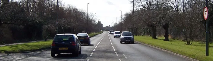 Hampton Court Way, perfectly straight and symmetrical, looking southwards. Click to enlarge