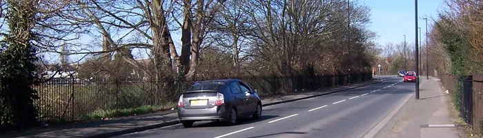 Spur Road, looking north towards the railway bridge: short and not very wide. Click to enlarge