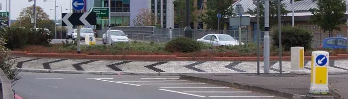 A modern roundabout with deflection on entry, on the A24 in south London. Click to enlarge
