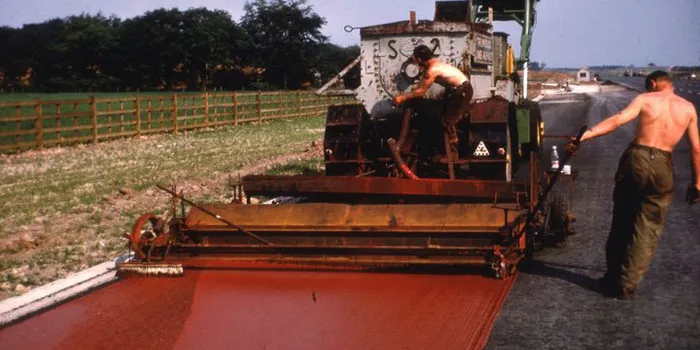 Paving new hard shoulders, 1963. Click to enlarge