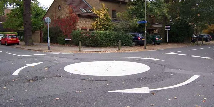 A mini roundabout, more often driven over than around. Click to enlarge
