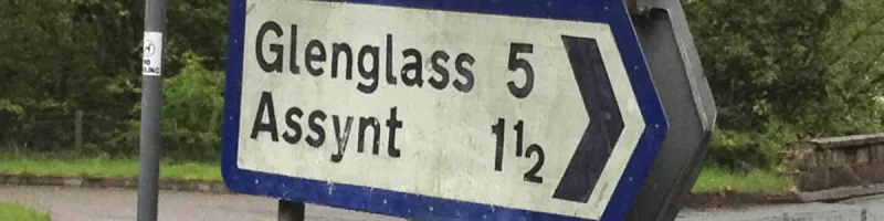 A surviving local direction sign with thick Worboys-style borders near Ullapool. Click to enlarge