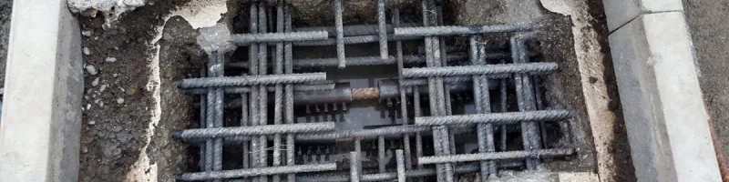 Repairs to corroded rebar in progress, with new segments spliced in. Click to enlarge