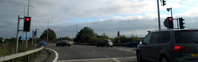 Traffic lights at M4 junction 8/9. The blue sign on the left says "Motorway regulations still apply, no stopping". Click to enlarge