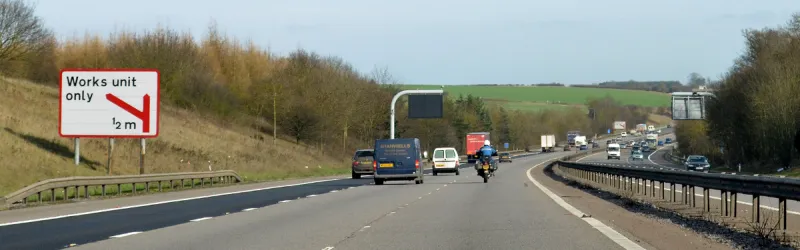 A strangely coloured sign on the M4, and another in the distance. What works happen here? Click to enlarge