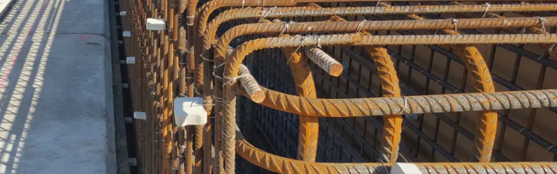 Steel reinforcement bars (rebar) awaiting a coat of concrete. Click to enlarge