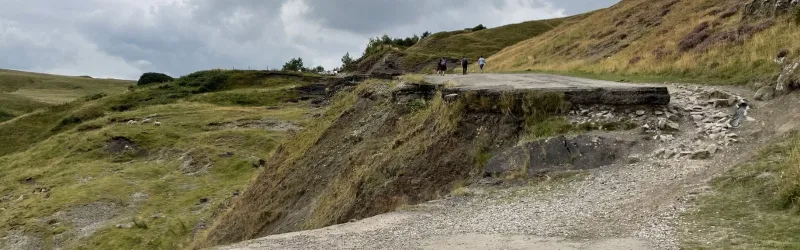 A cliff face where one part of the road has dropped further than another. Click to enlarge