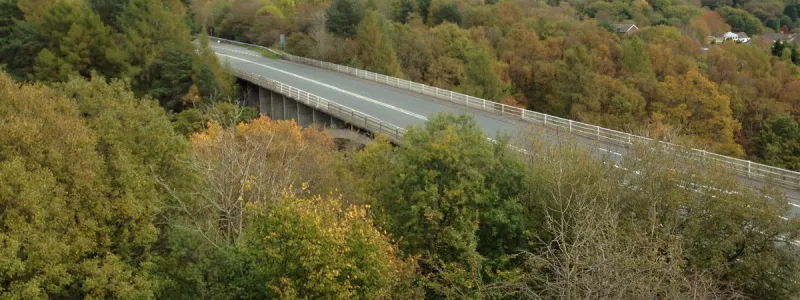 The Heads of the Valleys Road crosses the Taf Fechan valley, with Merthyr Tydfil's Gurnos estate in the distance. Click to enlarge