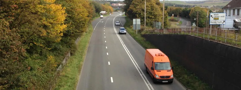The Heads of the Valleys Road at Pant, north of Merthyr Tydfil, originally designed to have a "suicide lane". The double white lines are a modern addition. Click to enlarge