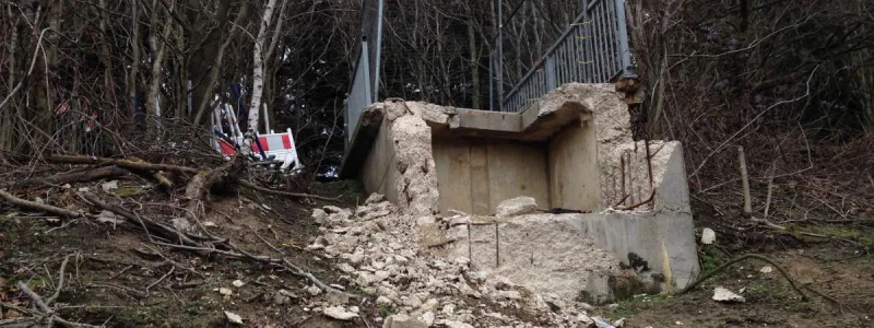 The north end of the bridge is now a ruin with rubble spilling down the embankment. Click to enlarge
