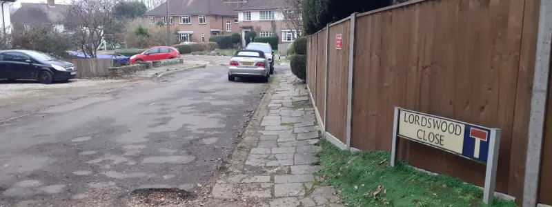 Lordswood Close, Southampton. The adopted road ends where the potholes start. Click to enlarge