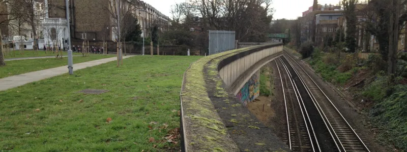 A stub of the unbuilt northbound off-slip to Holland Park Roundabout still hangs over the railway. Click to enlarge