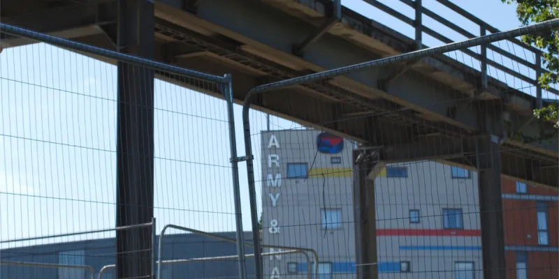 Behind bars: temporary fencing now surrounds the flyover, presumably as a safety measure. Click to enlarge