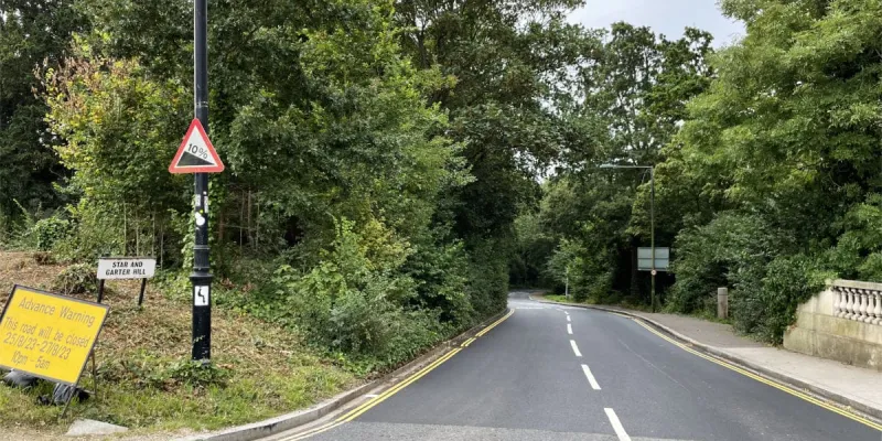 The B353 Star and Garter Hill, the road that would be bypassed by the tunnel, with a warning sign for its 10% gradient. Click to enlarge