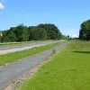 The first is facing south standing in the former northbound lanes of the A74. There road is passing over a bridge, although this is very difficult to see thanks to all the growth on the northbound carriageway. The giveaway is what appears to be a break in the barrier on the side of the southbound carriageway, which seen up close is the brick papaphet for the bridge. Quite why this isn't protected by a barrier is a bit of mystery.