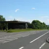 This abandoned petrol station was abandoned even when the A74 was in use. In the distance the new A74(M) can be seen taking a lower alignment on the hillside. The original carriageways have been completely redesigned around here, with the northbound completely removed and the southbound widened to accommodate two large cycle lanes on either gutter.