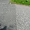 Here a catseye can be seen and one of the former lane markings and over by the cycle path the old solid edge line can be seen.