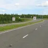 While facing southwards the road takes a sudden turn onto the northbound sliproad of M74 junction 11 to briefly become single carriageway to get underneath the motorway. Originally it would've continued on a straighter alignment across the path of the current motorway.