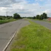 Northwards, the old road looks exceptionally erie here, with the long abandoned portakabins either side of the road. An old right-turn lane is visible in the foreground as the road makes it arrow-straight course over the horizon.