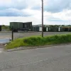 The portakabins on the the west side of the B7078, directly opposite those shown in the picture above.