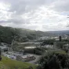 A view south across part of Halifax's town centre, across the foothills of the Pennines. The geography of this area is best described as sudden, and is the main reason that Halifax's town centre bypass is within the town and built to such extraordinary designs.