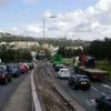 The sliproad meets the main carriageway just yards before the roundabout, and is signalised. If a conventional merge were used here, getting into lane for the roundabout would be virtually impossible. Had the rest of the plans been realised, this would have been a junction between two sliproads, and therefore not as congested.