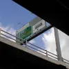 Gantry signs are mounted on the viaduct both ways to direct traffic. Eastbound, only the left hand lane is marked for through traffic on the A58 - clearly this was not the intended final layout.