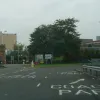 Around the northern side of the roundabout, there's an exit on the right for a coach park! Coach drivers with a sense of fear need not attempt this turn. Somehow there's a parking area for coaches inside the roundabout. It exits back onto the inside behind us.