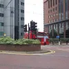 The first junction, a three-way signalised intersection with Station Road, is mostly for buses and trams. Regular traffic can enter the road here, but will usually find it slow progress behind a line of double deckers. The two tall buildings here are the last on Wellesley Road, which reverts to low-rise suburban housing just to the right.
