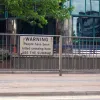 Signs on the central barrier show the difficulties that pedestrians have faced before now.