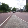 Looking south at the point where the southbound sliproad and main carriageway merge. Four lanes continue from here up to the roundabout, which is only 60m (65 yards) from the camera here. In that space traffic must fight its way right or left to be in the correct lane.
