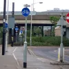 On the west side of the Roman Way flyover, this is Cairo New Road - the street that used to pass under Roman Way and join up the two halves of the grade-separated junction. It's now one way (westbound) underneath, which is why the junction on top has been signalised. Croydon Tramlink passes through the space it used to occupy, leaving room for just one lane of traffic.