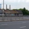 On top of the Roman Way flyover, looking north-west at the two chimneys of Ikea Croydon. These houses are just a handful of those in the shadow of this enormous road. There was massive local opposition to it being built, and the local newspaper described it as the "Berlin Wall" in recognition of the way it divided a previously continuous residential area.