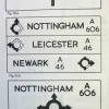 An attempt to stack destinations on roundabout signs results in some interesting arrow designs. The bottom sign is "Continental" in style, and is closest to what was eventually adopted.