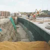 The completed M62 tunnel structure walls and roof slab, being backfilled.
