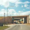 The new bridge constructed to the east of the existing bridge. The retaining walls to the south were constructed in reinforced earth and the hexagonal facing panels used in construction can be seen before the brick cladding was constructed. Photograph taken 15 August 1998.