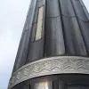 Like everything else, it's intricately decorated. There are smaller lights around the outside here as well as the large globe on top. It's hard to tell exactly what it is made of, but presumably it has a shell of some sort of metal. Aside from some moss here and there it's in an unbelievably good condition.
