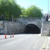 Where else should we start if not the tunnel mouth itself? Unlike its opposite end, the Liverpool portal is rounded, exposing the shape of the tunnel itself, and sunken slightly into the surrounding landscape.