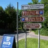 A cluster of signs inhabit the traffic island where Swanage Road ends. Beyond this junction, Ferry Road is owned by the ferry company.
