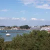 From the top of the dunes, the slipway on the opposite shore is visible, sticking out from the thickly wooded shores of Sandbanks.