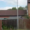 This is one of the few remaining examples of the original lights used within the housing estates. The vast majority have been replaced, and with good reason: it's impossible to say how effective they were when first installed, but today these lights emit a pale greenish glow (most of which is lost out of the top of the lamp) that does nothing to brighten the street.