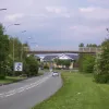 We continue along Birchwood way and, looking back the way we came, this footbridge crosses the road shortly after the roundabout. It's another clue that the road was meant to be much bigger.