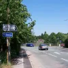 At Padgate station, the road turned sharply to cross the railway bridge. The New Town developers widened this bridge and realigned the through route to the left to connect with Birchwood Way. The original route is to the right. The junction has been 'New Towned' with a pedestrian subway and new lighting, but once we're off the road it's back to the original route.
